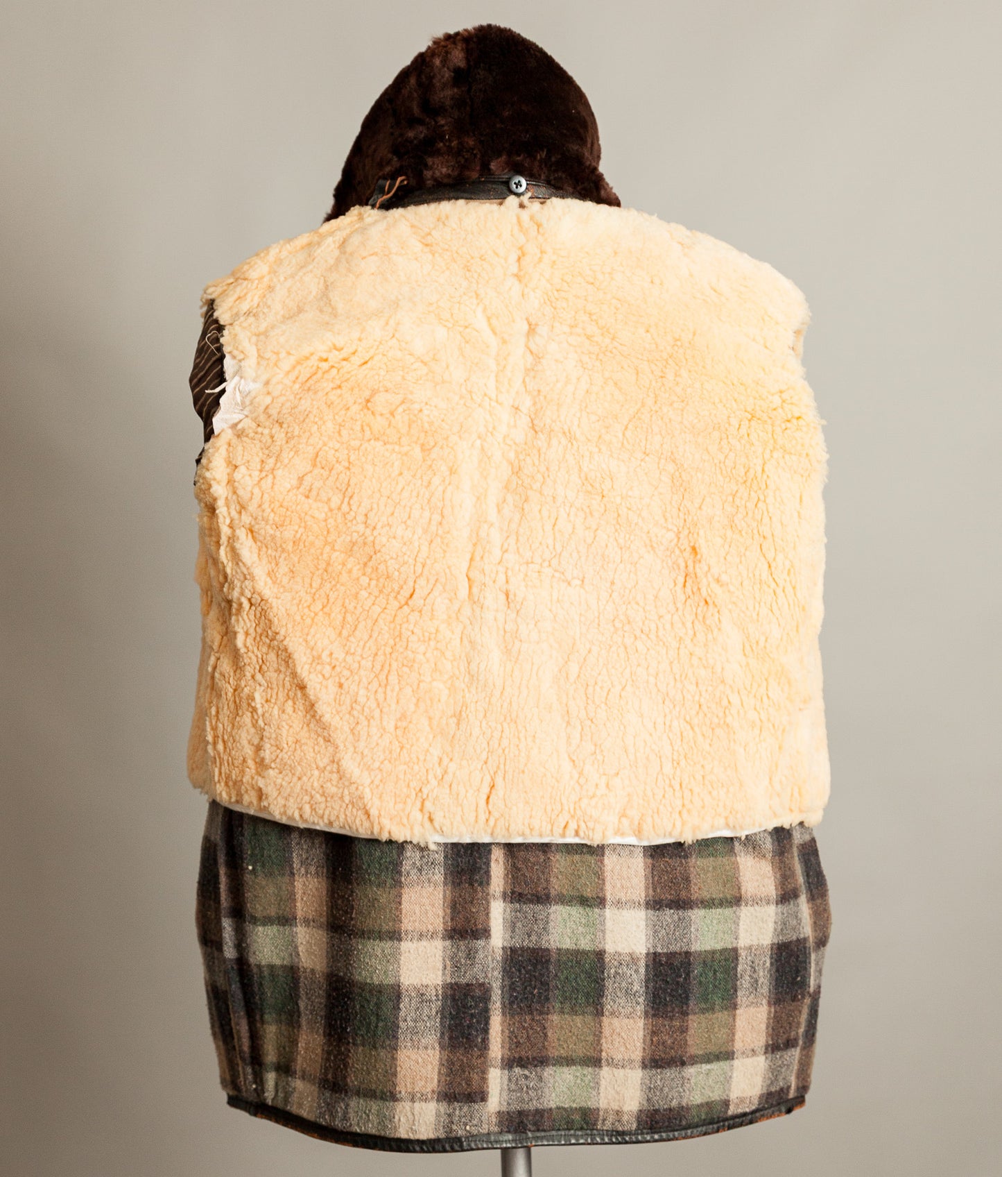 Sheepskin liner and plaid wool interior from vintage French leather workwear jacket