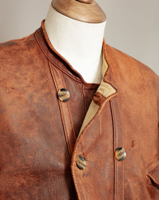 Vintage vegetable-tanned leather jacket with patina and button front, showcasing natural ageing and craftsmanship — featured by Revive & Restore Vintage.