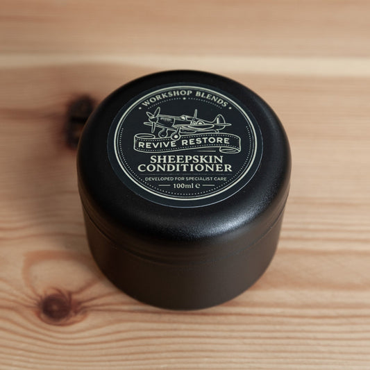 Revive & Restore Vintage Sheepskin Leather Conditioner – Workshop Blend tin on wooden surface