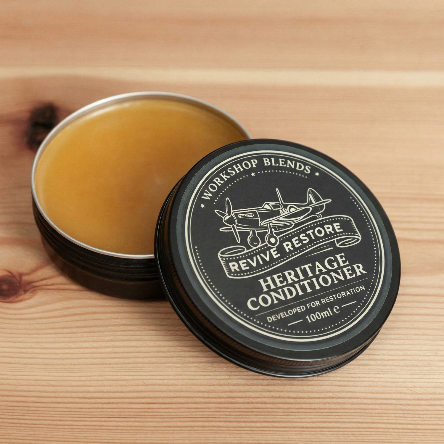 in of Revive & Restore Vintage leather conditioner on a wooden workbench