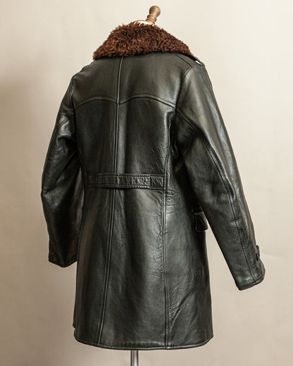 Swedish Military 1940s Black leather Trench coat with a brown wool collar on a mannequin against a beige background