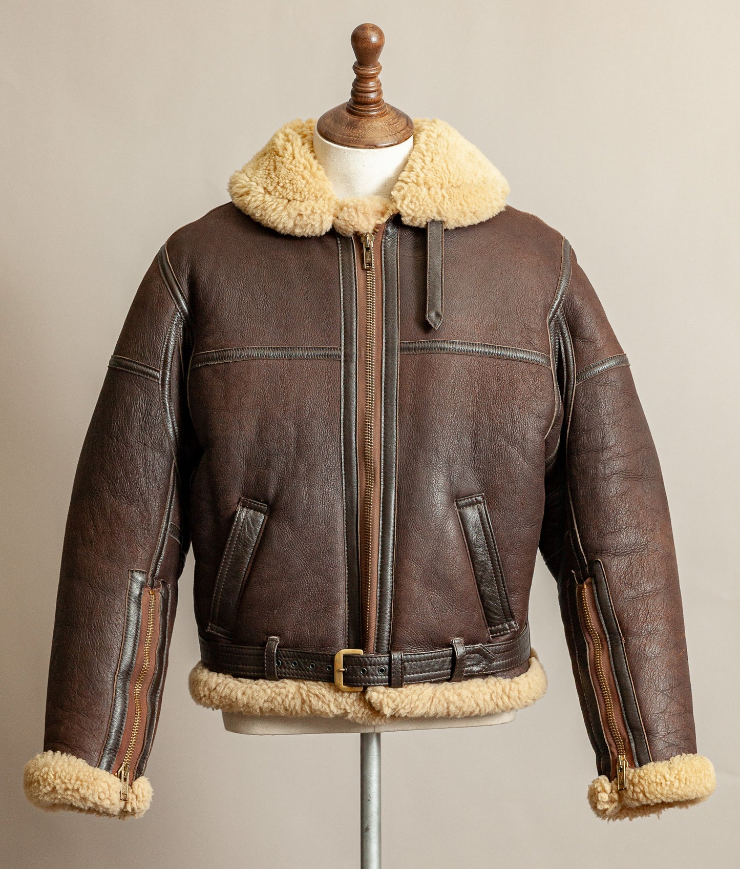 Vintage 1980s Top Stitch Irvin-pattern sheepskin flying jacket in brown leather with honey fleece – front view.
