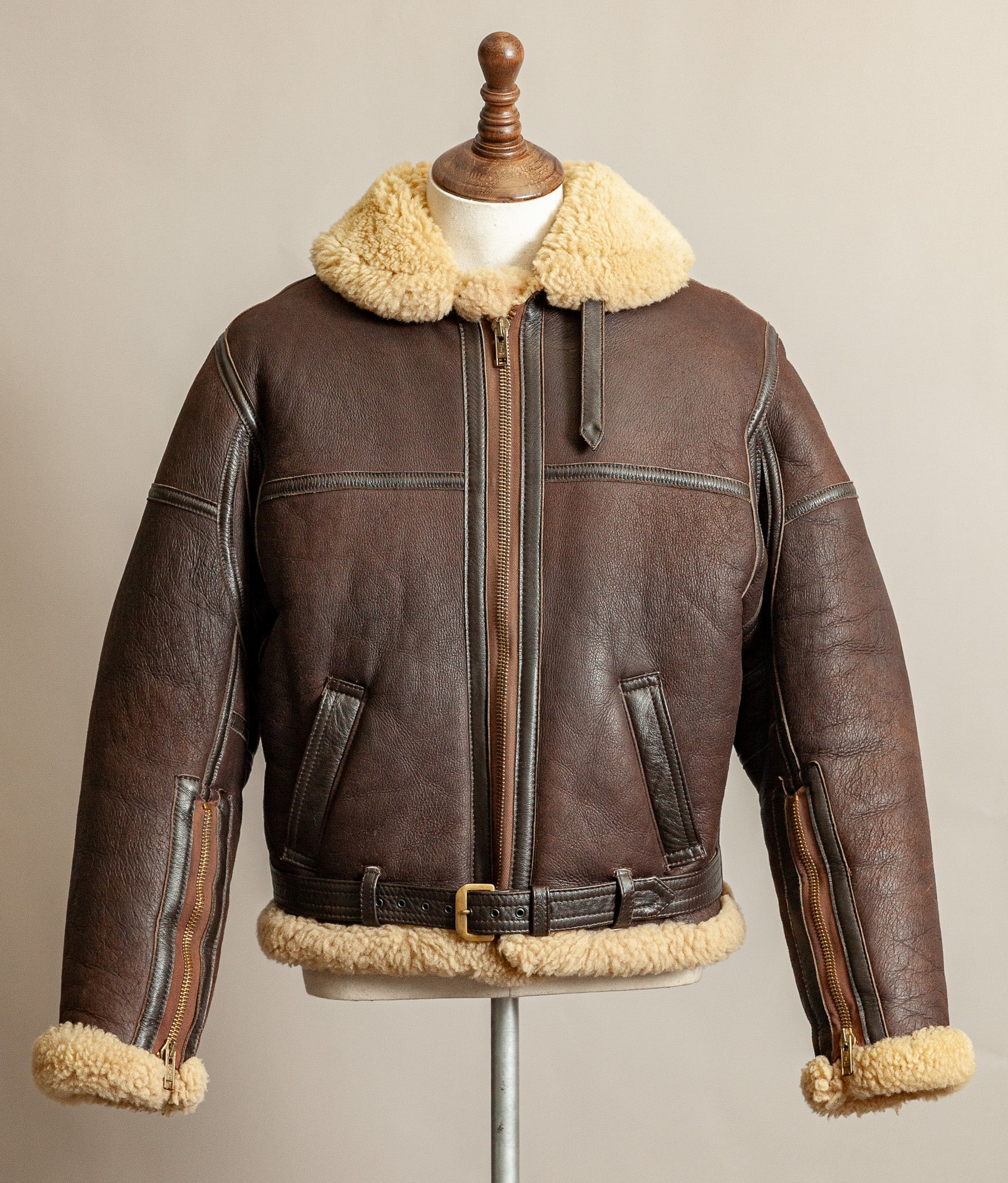 Vintage 1980s Top Stitch Irvin-pattern sheepskin flying jacket in brown leather with honey fleece – front view.