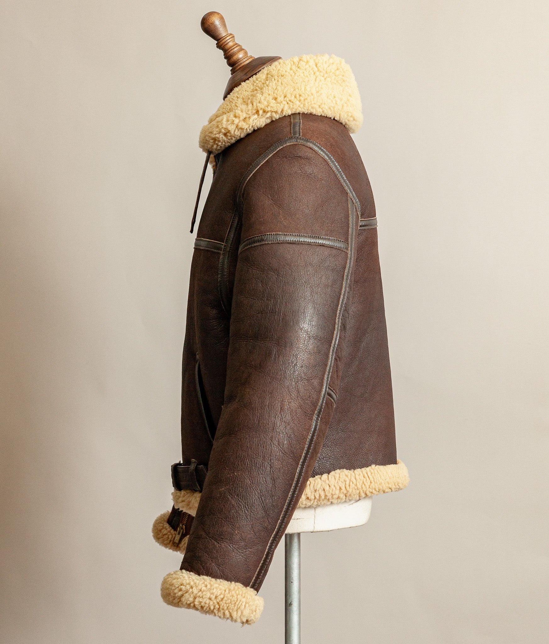 1980s Top Stitch Irvin-pattern sheepskin flying jacket – side view left arm showing patina and seam construction.