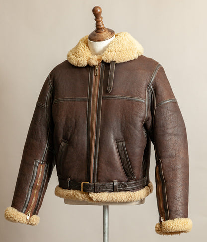 1980s Top Stitch Irvin-pattern sheepskin flying jacket, front right side of view showing patina and seam construction.