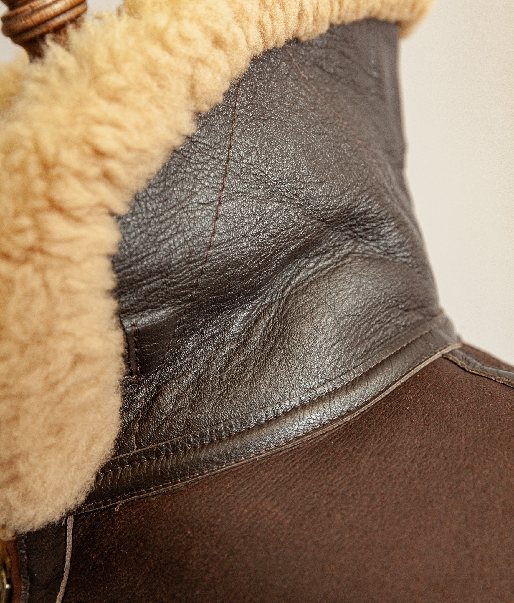 close up of the collar stood high, diagonal stitching pattern and wool 