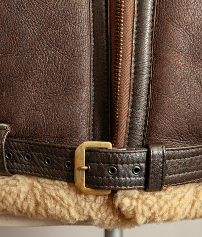 Brass RAF Irvin belt buckle and stitching details of the belt, the colour is dark brown and brass