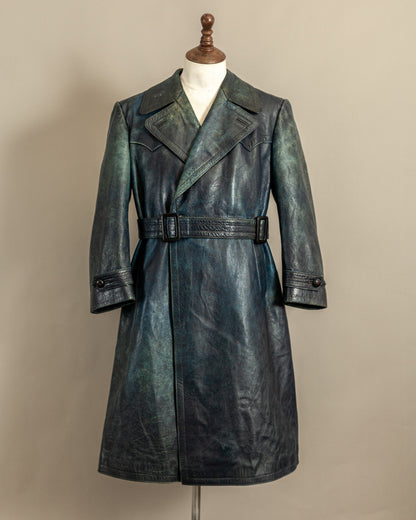 Vintage 1940s German blue full grain leather trench coat on a mannequin with wide lapels and belted waist.