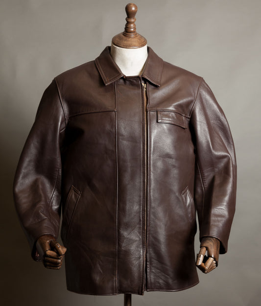 Vintage 1950s French dark brown leather work jacket by Cuiram Paris with shirt collar and Éclair zip, on a wooden mannequin