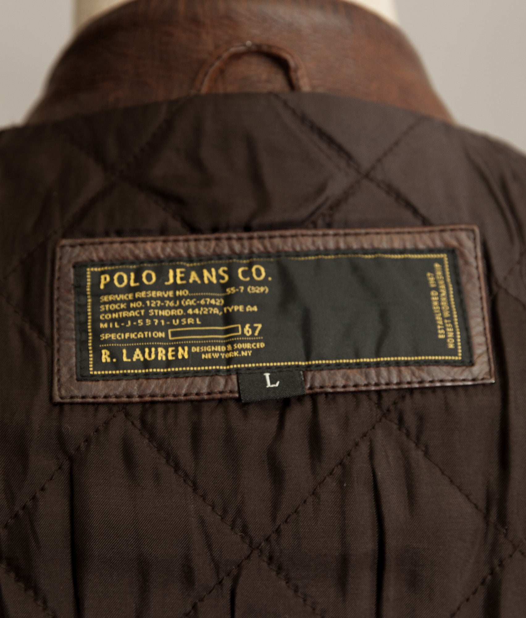 Close-up of a Polo Jeans Co. label on a brown jacket