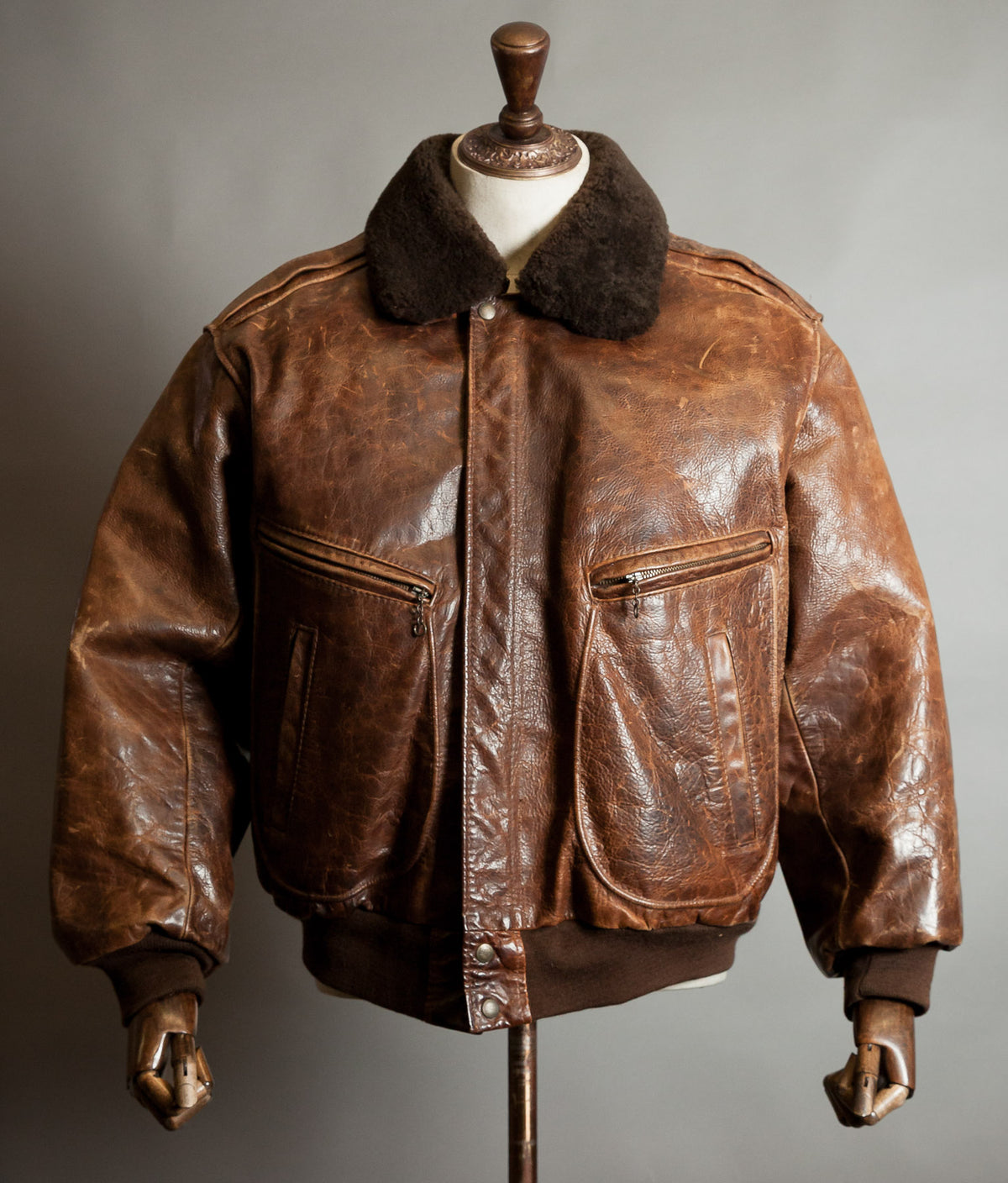 Front view of vintage Redskins B32 steerhide flight jacket in patinated tobacco brown leather with brown shearling collar and knit cuffs