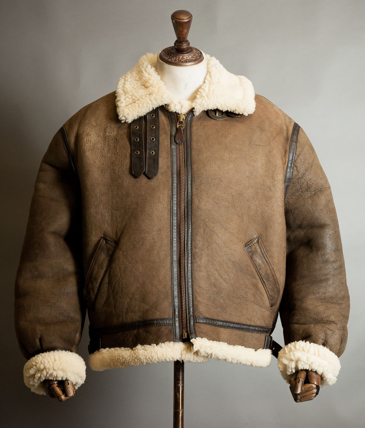 Front view of vintage 1990s Schott B-3 sheepskin flying jacket in aged brown with cream shearling collar, cuffs and hem, size XL