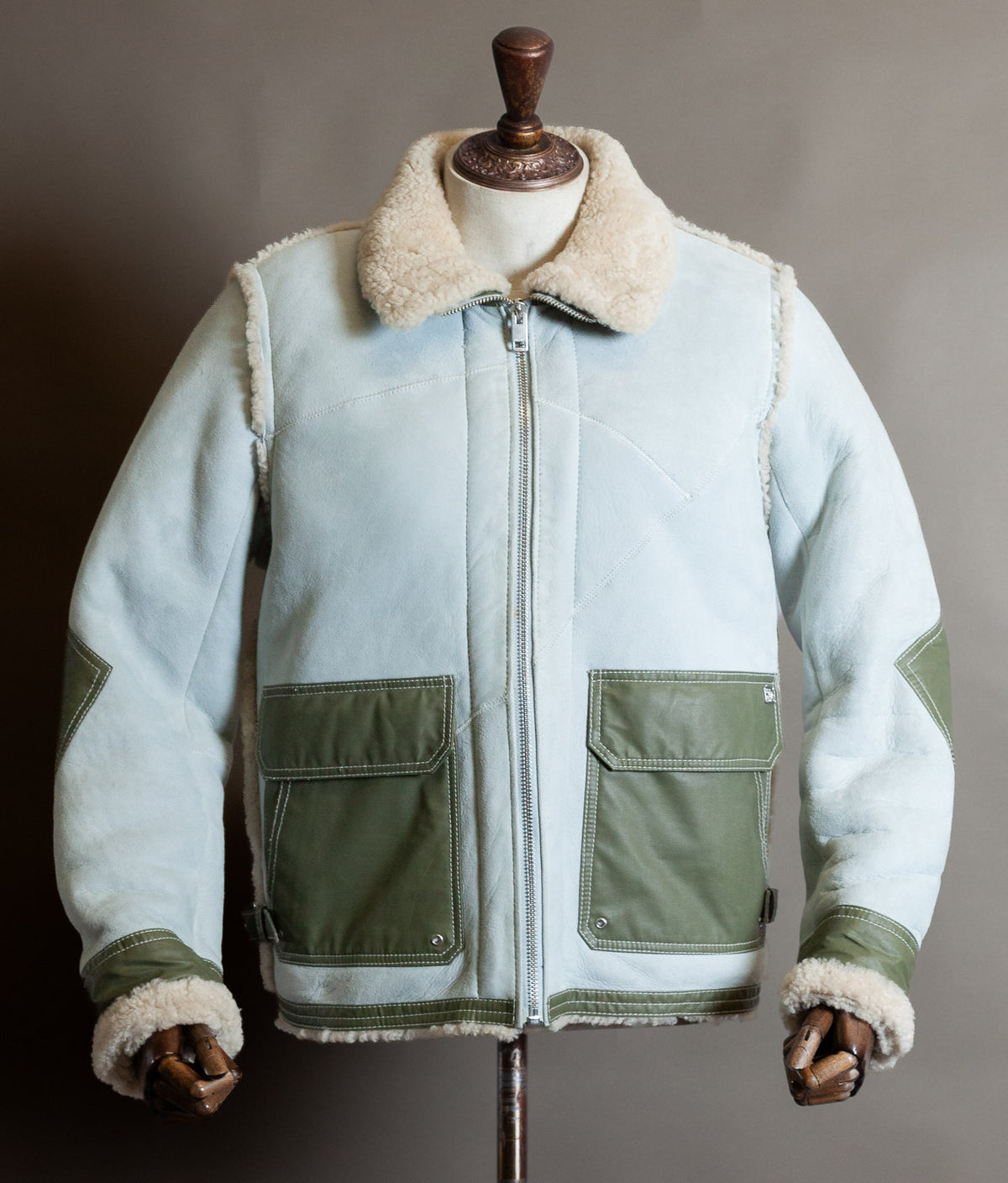 Men’s Diesel Heritage shearling aviator jacket in ice blue suede with olive green pockets and cream sheepskin collar, as worn by Justin Bieber